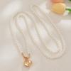 European and American Peach Heart Pendant Necklace: Women's Fashionable Long Pearl & Clavicle Layered Chain.