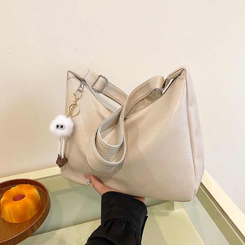 

Летние женские сумки большой вместимости 2025 новые городские простые и популярные женские сумки сумки-мессенджеры модные сумки через плечо single package белый