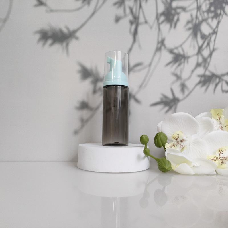 Available 60ml Transparent Black Foam Mousse Bottle for Face Wash and Travel-friendly Cosmetic Packaging.