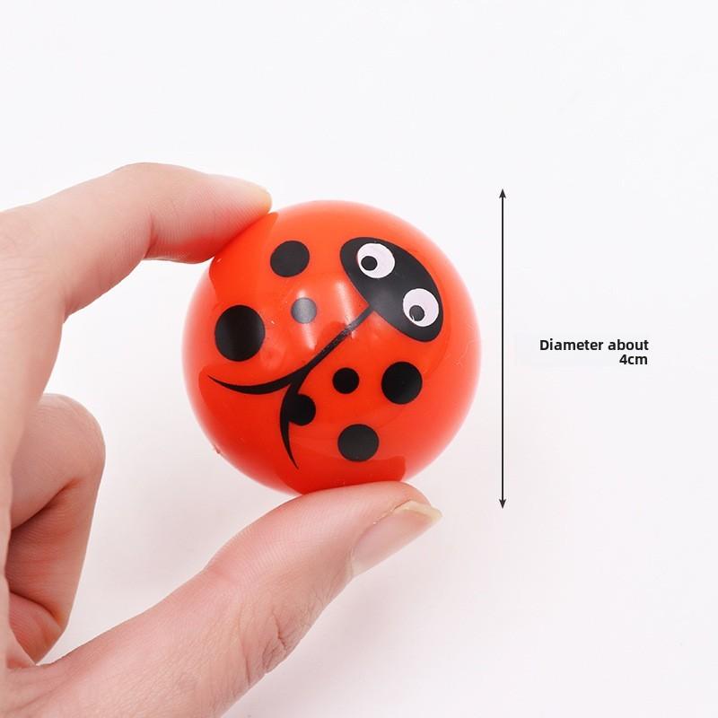Mini-Aufziehspielzeug aus Kunststoff mit Cartoon-Ausdruck Halbkugel-Design für Kinder und Familienspaß