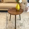 A Simple, Casual and Artistic Small Round Table Beside the Balcony Sofa, a Small Round Table and a Small Coffee Table