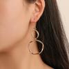 European & American Style Geometric Alloy Drop Earrings: Simple, Hollow, Round Design for Women.