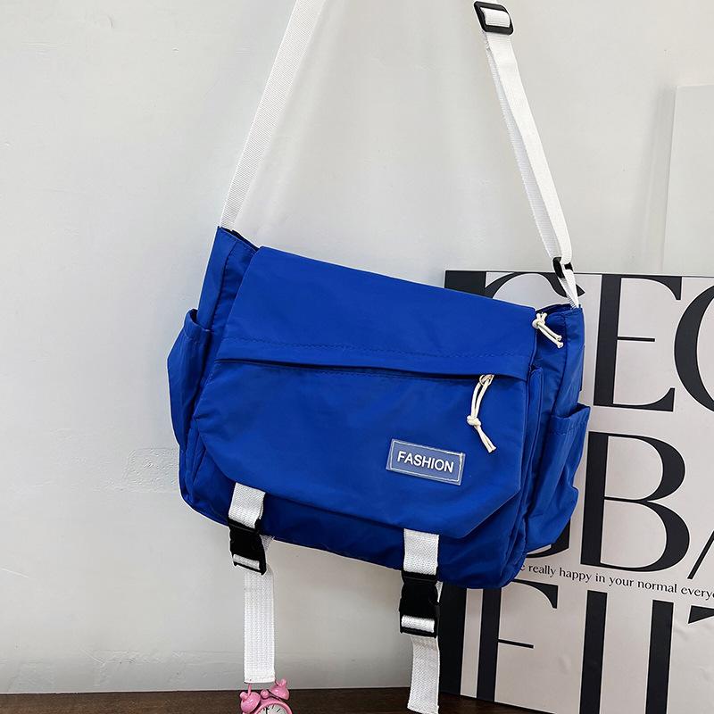 Large capacity tooling multi-pocket messenger bag leisure student shoulder versatile messenger bag solid color anti-splashing women's bag