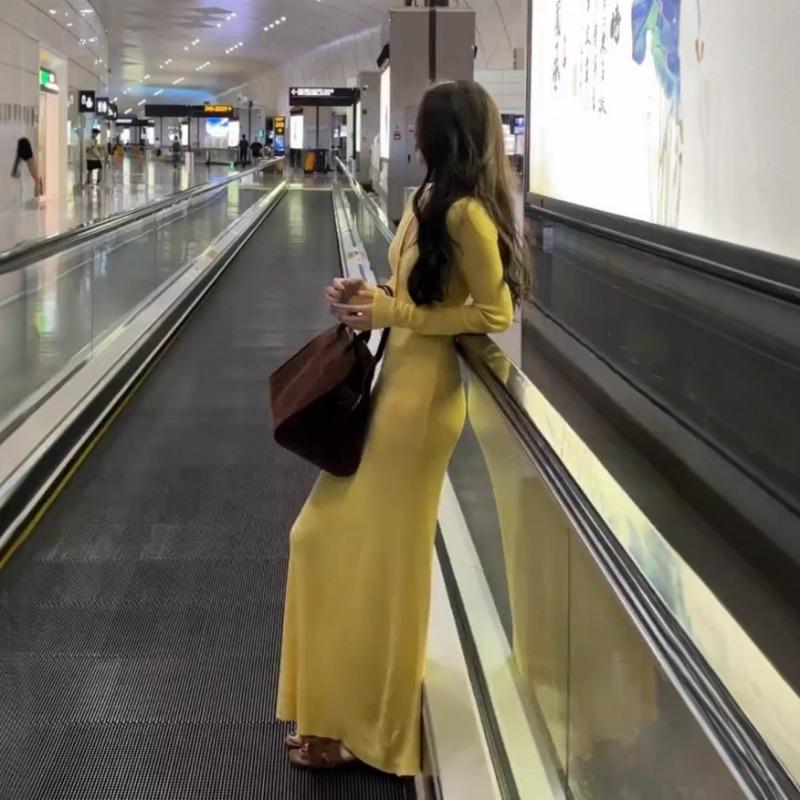 Yellow slim-fitting long-sleeved knitted dress women's autumn tight-fitting temperament long dress casual waist-wrapped hip skirt