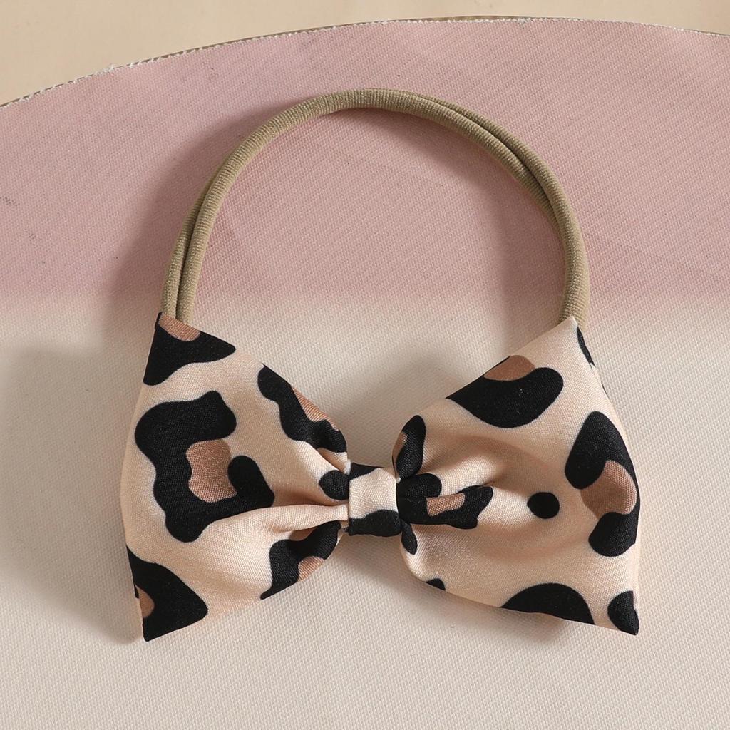 Euro-American Baby Long-Sleeve Set: Letter Bowknot Bodysuit, Leopard Bib Overalls, and Headband