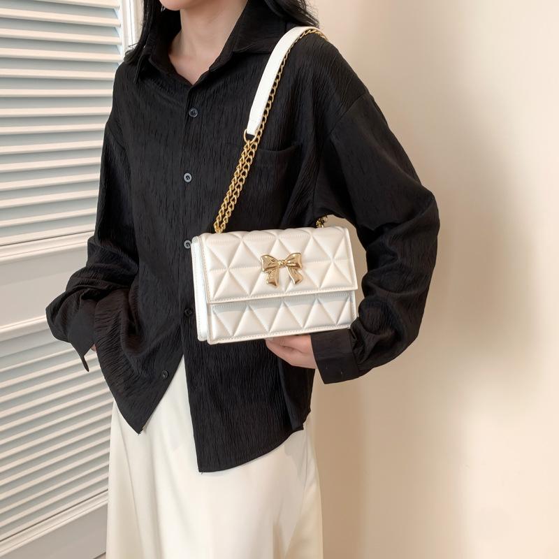 Geantă de mână cu lanț și design de nișă pentru femei, de primăvară, nouă, la modă, cu arc decorativ, cu un singur umăr, cu romb oblic, pătrat