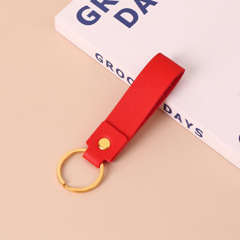 Creative Minimalist PU Leather Keychain: Solid Color Car Anti-Lost Pendant and Bag Accessory