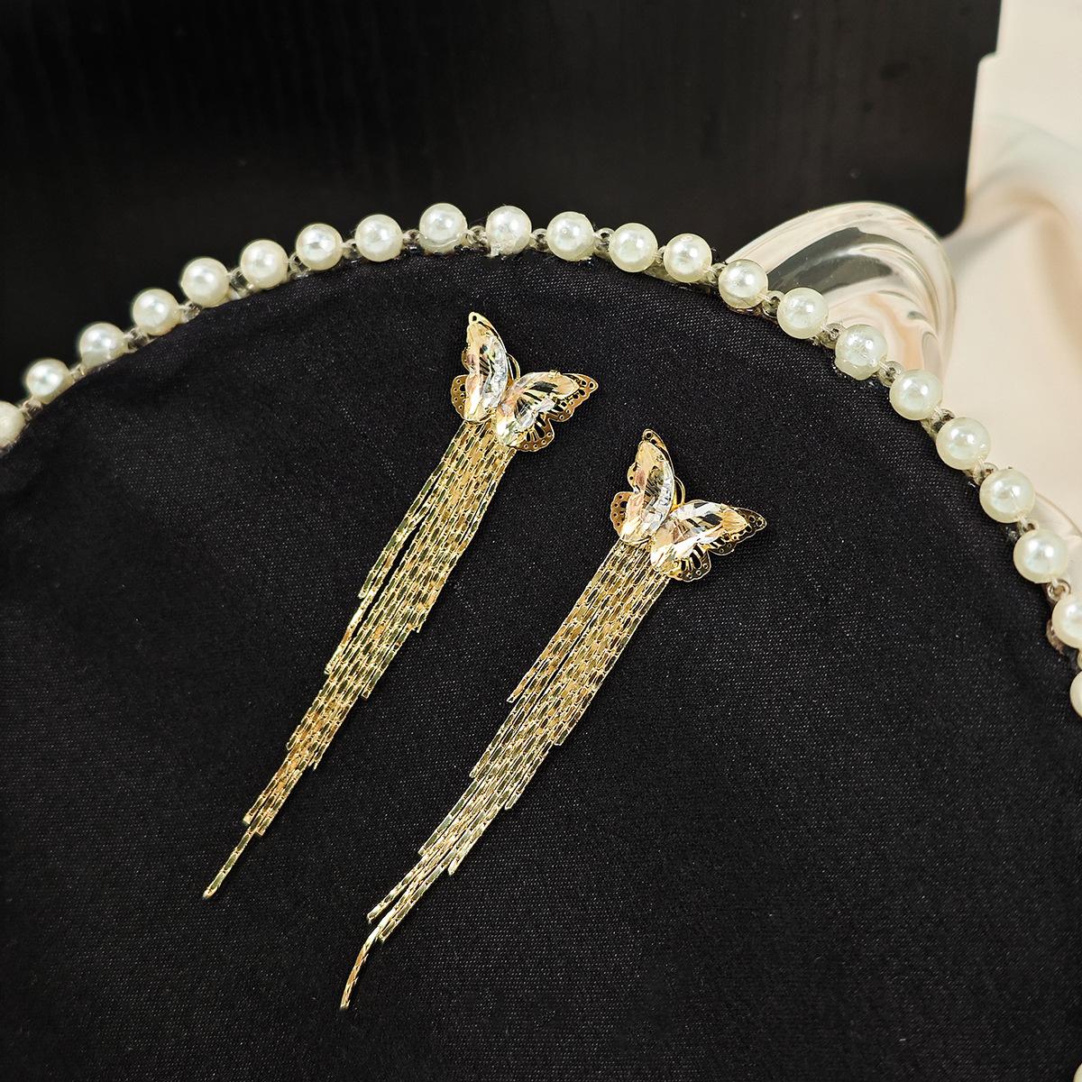 

Женские сверкающие серьги-бабочки с кисточками и уникальным дизайном золотой