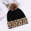 European and American fashion leopard print hairball decoration niche versatile knitted hat autumn and winter travel windproof warm wool hat