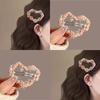 The Flower Hairpin Is Sweet and Ethereal. The Shark Hairpin Is Held At The Back of The Head