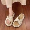 2025 new thick bottom stepping on shit feeling one-word sandals women summer wear Internet celebrity casual retro pearl national style slippers