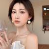 Hong Kong style elegant temperament pearl earrings women's ear buckle type niche unique design earrings European and American cold wind earrings