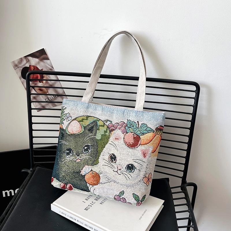 

Embroidered canvas portable double-sided gold thread cartoon women s hand bag casual hand bag small cloth bag lunch box bag 35X7X27cm