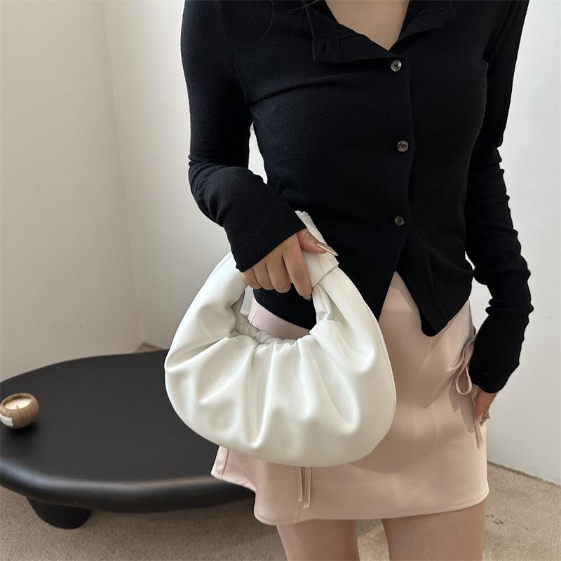 Unique niche design bag, new women's bag, popular in summer, versatile handbag, portable wrist bag