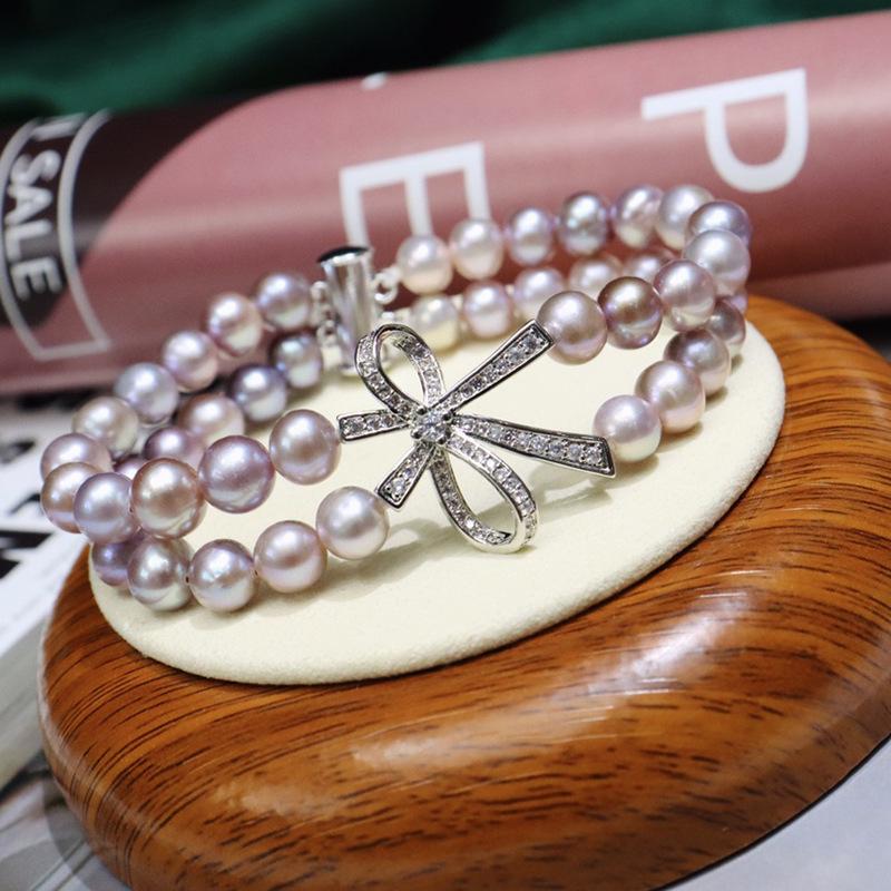 077 Freshwater Pearl Bracelet 7-8mm with Bow Design: Versatile, Elegant, High Luster Jewelry with Minor Flaws