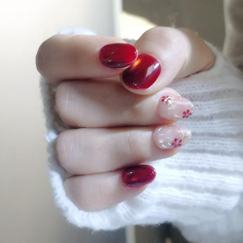 New Year Ruby Cat Eye Press-On Nails: Hand-Painted Plum Blossom, Elegant Skin-Whitening Short Nails