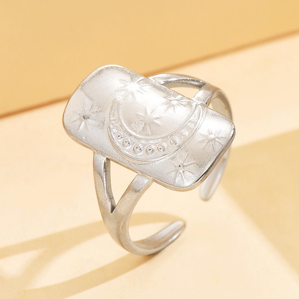 Adjustable Stainless Steel Star and Moon Ring with 18K Gold Plating.