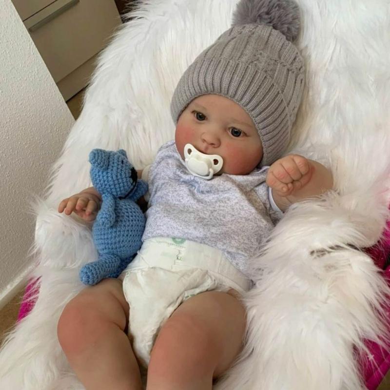 23,62 Zoll Reborns Beliebte Schmollende Niedliche Mädchenpuppe mit Windelhauben Weiche Kuschelpuppe für Kleinkind Geburtstagsgeschenk
