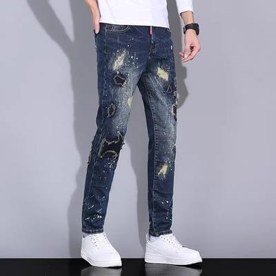 Kraftig utformet glidelås jeans med rette ben Jeans med små ben Broderte blå uformelle jeans herrebukser