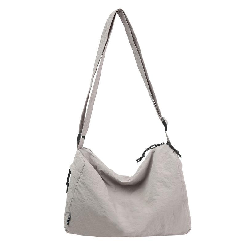 Crossbody bag New couple casual mailman bag Large capacity short trip bag Sports shoulder bag