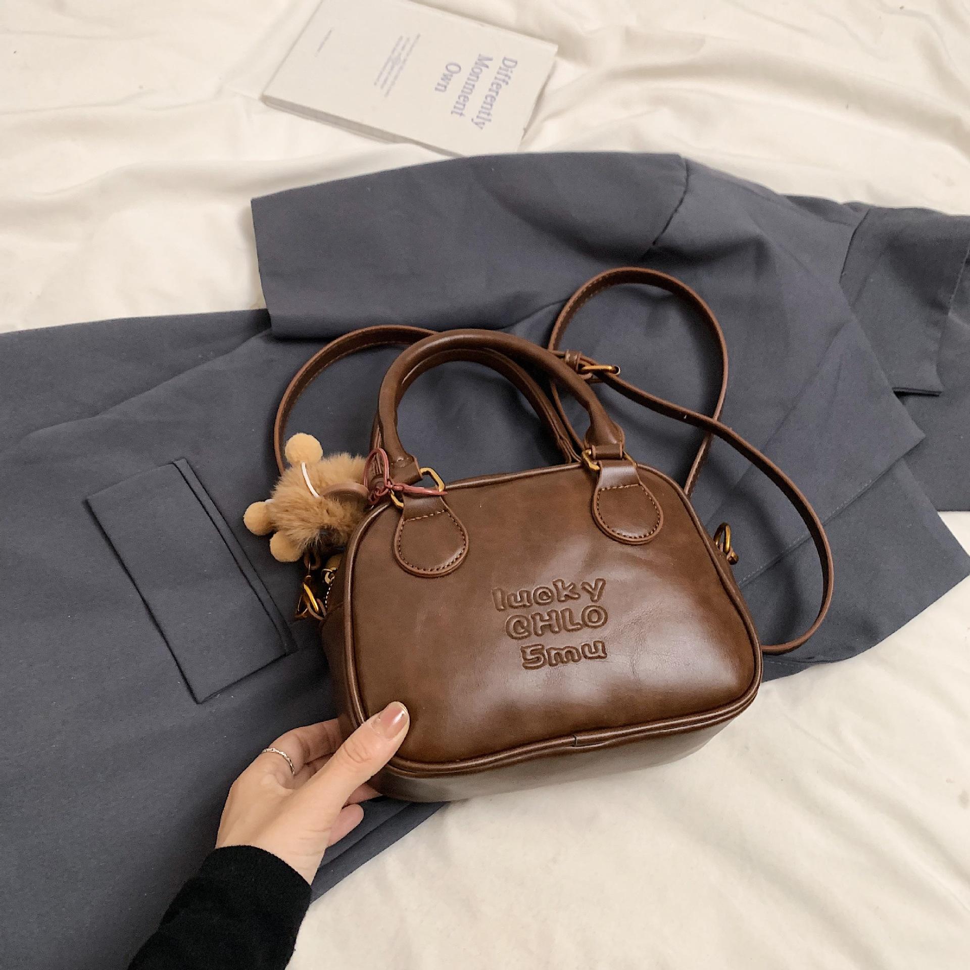 

Нишевая ретро сумка-боулинг женская 2025 новая модная на плечо, сумка-мессенджер, премиальная текстура, кофейная сумочка коричневый