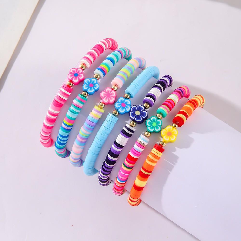 Korean version of fashion new multi-layer elastic thread soft pottery love smiley face bracelet set retro handmade pearl jewelry women