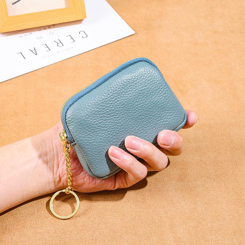

Leather hand zipper small wallet women s first layer cowhide mini bag key storage coin bag cute change bag світло-синій колір