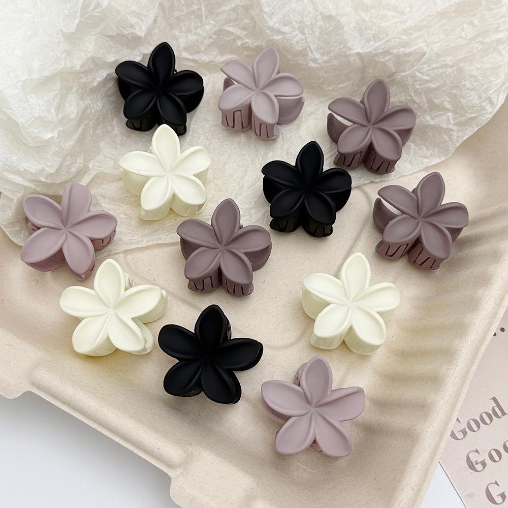 

Mini Frangipani Flower Claw Clip in Milk Coffee Color Rubber Paint Frangipani Light Coffee