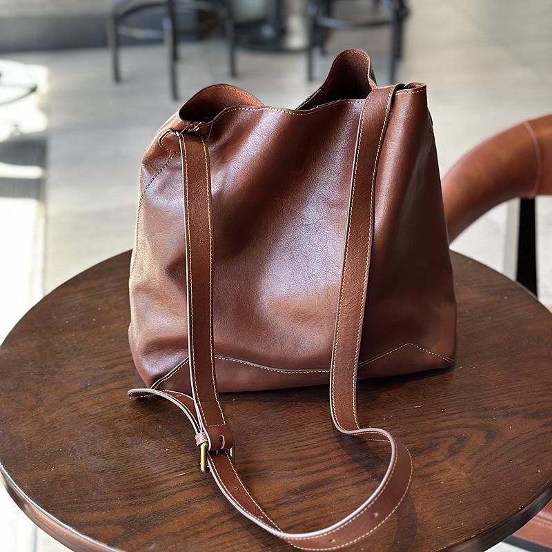 

Korean Retro Leather Bucket Bag: Women s Large Capacity Vegetable-Tanned Cowhide Tote, Single Shoulder & Crossbody.