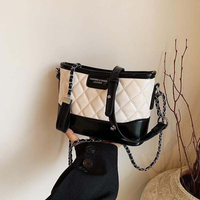 

В этом году популярная сумка-ведро супер огонь женская 2024 новая летняя легкая роскошь нишевая высококлассная повседневная сумка-мессенджер слоновая кость