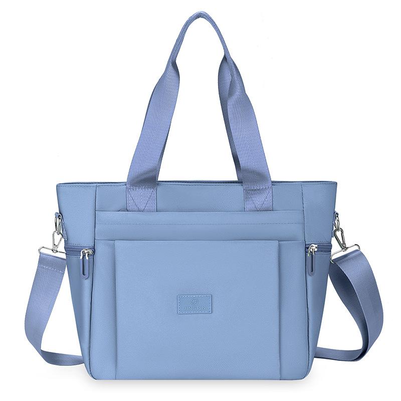 Borsa a mano versatile a spalla singola, borsa grande da donna, nuova versione coreana in tessuto di nylon, grande capacità, semplice borsa tote per lo shopping