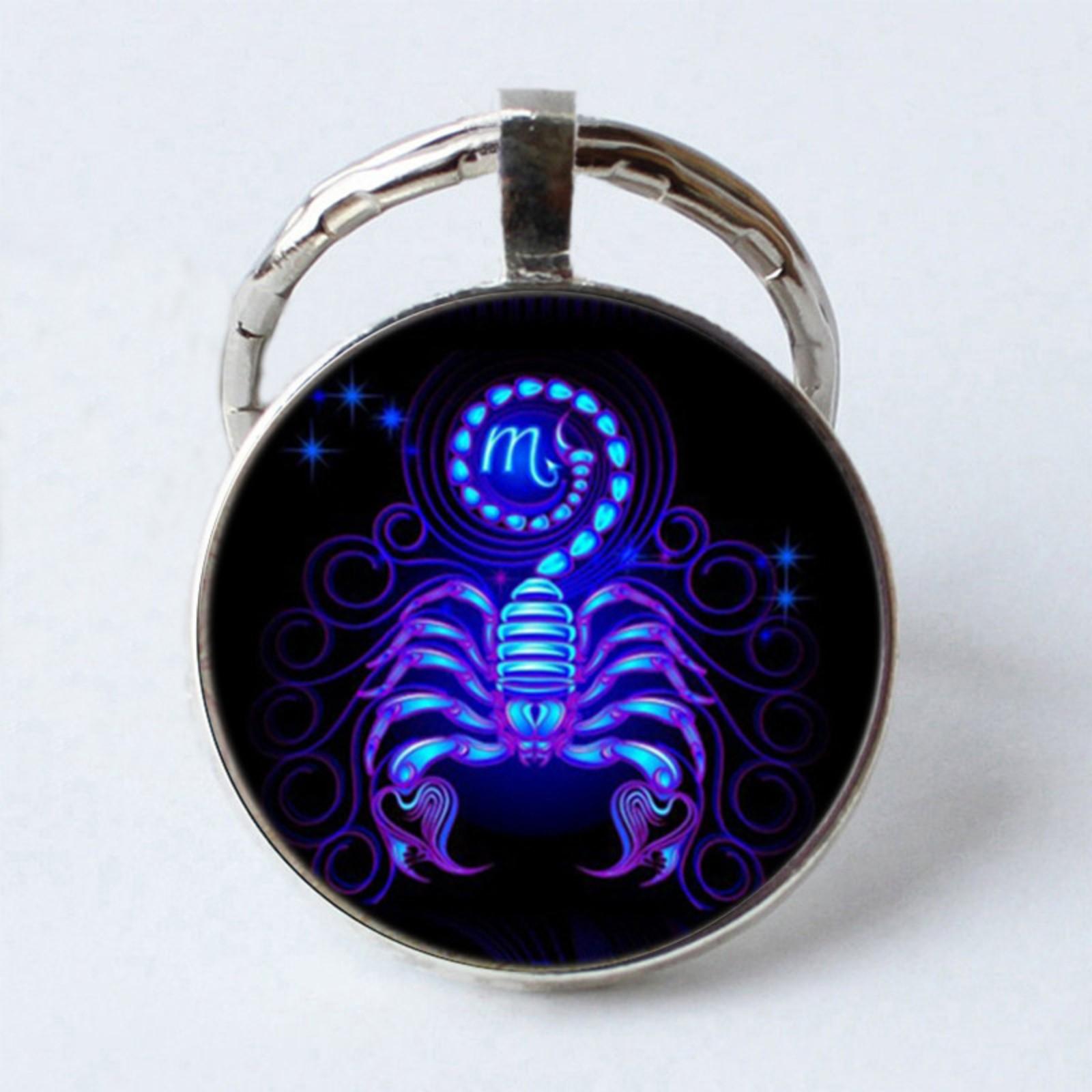 

Металлический брелок с драгоценными камнями и символами зодиака One Size