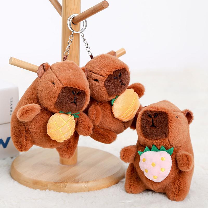 12Cm Cute Plush Capybara Holding Fruit Quick Pull Keychain Toy Cartoon Capybara Fluffty Animal Doll Plush Pendant Accessories