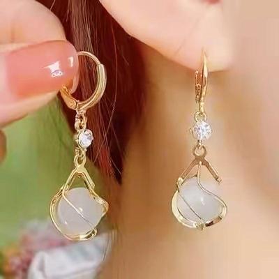 "Heart's Desire Cat's Eye Earrings: Trendy 2022 Korean Style for Women with Round Faces"