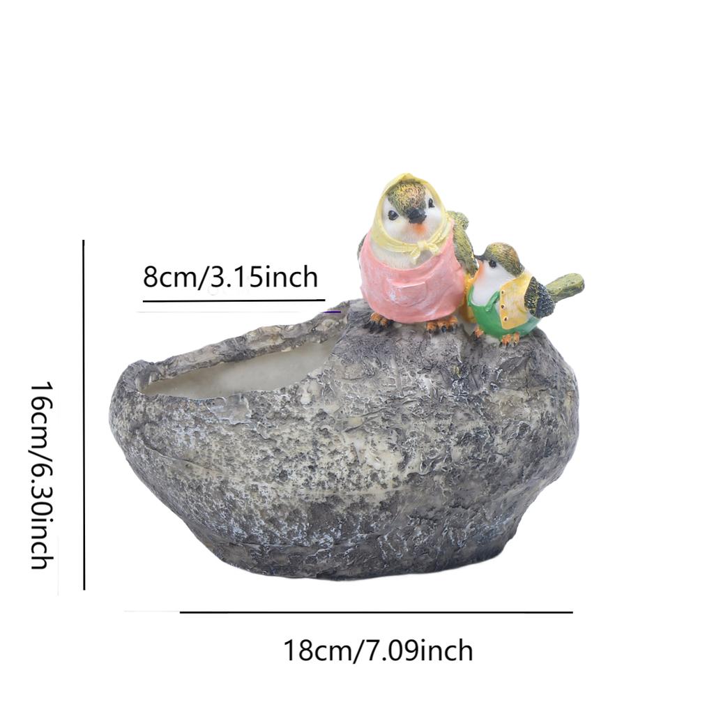 Decorative resin flowerpot with whimsical bird design weather resistant and for enhancing flower pot presentations