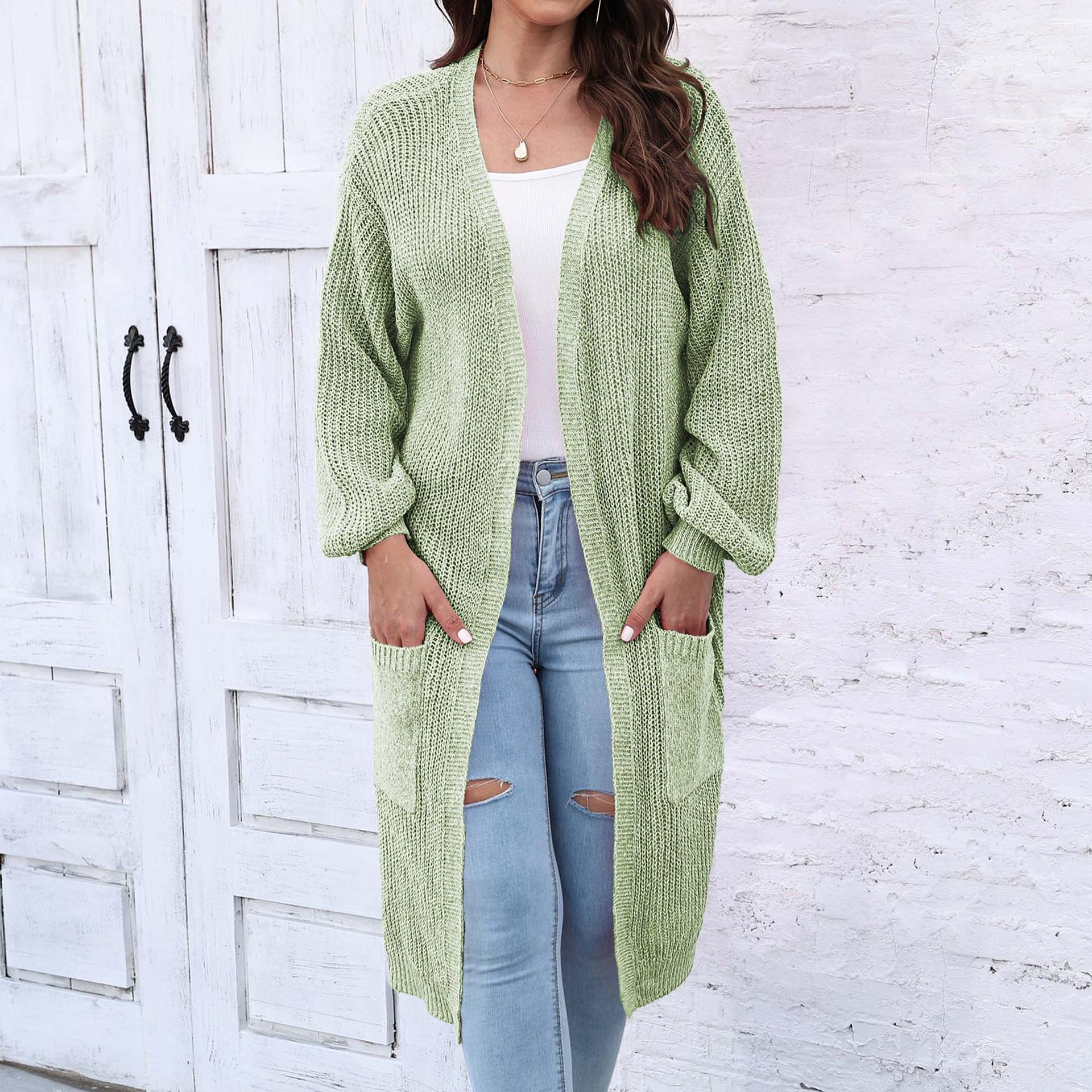 

Женский свитер средней длины с большим карманом и рукавами-фонариками на осень и зиму average size зелёный