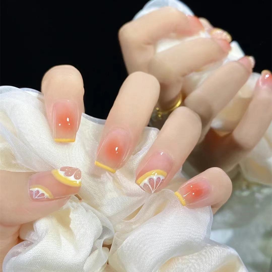 

Blush Orange Medium-Length Nude Summer False Nails