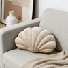 A seashell-shaped pillow, suitable for living room sofas, bedrooms, offices, and home decor.