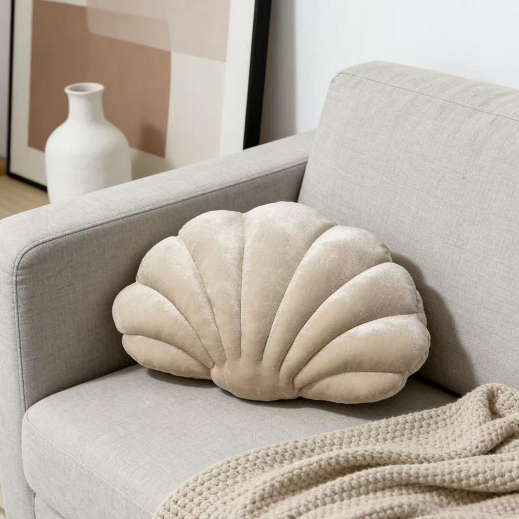 A seashell-shaped pillow, suitable for living room sofas, bedrooms, offices, and home decor.