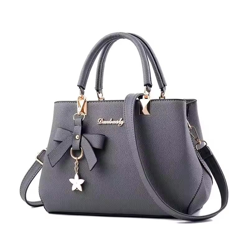 Eleganckie damskie torby listonoszki z wisiorkiem w kształcie kwiatka, torebki do pracy dla kobiet, czysta torebka dla kobiet, torby crossbody na ramię