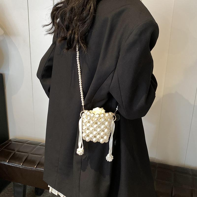 Daily commute imitation pearl woven hollow mini women lipstick earphone bag spring new shoulder messenger bag