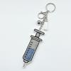 Rhinestone Syringe Keychain: Stylish Medical Staff Gift with Tassel Pendant