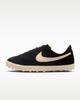 IQ7611-001 Nike Astrograbber Suede "Black/Muslin" (Women's)