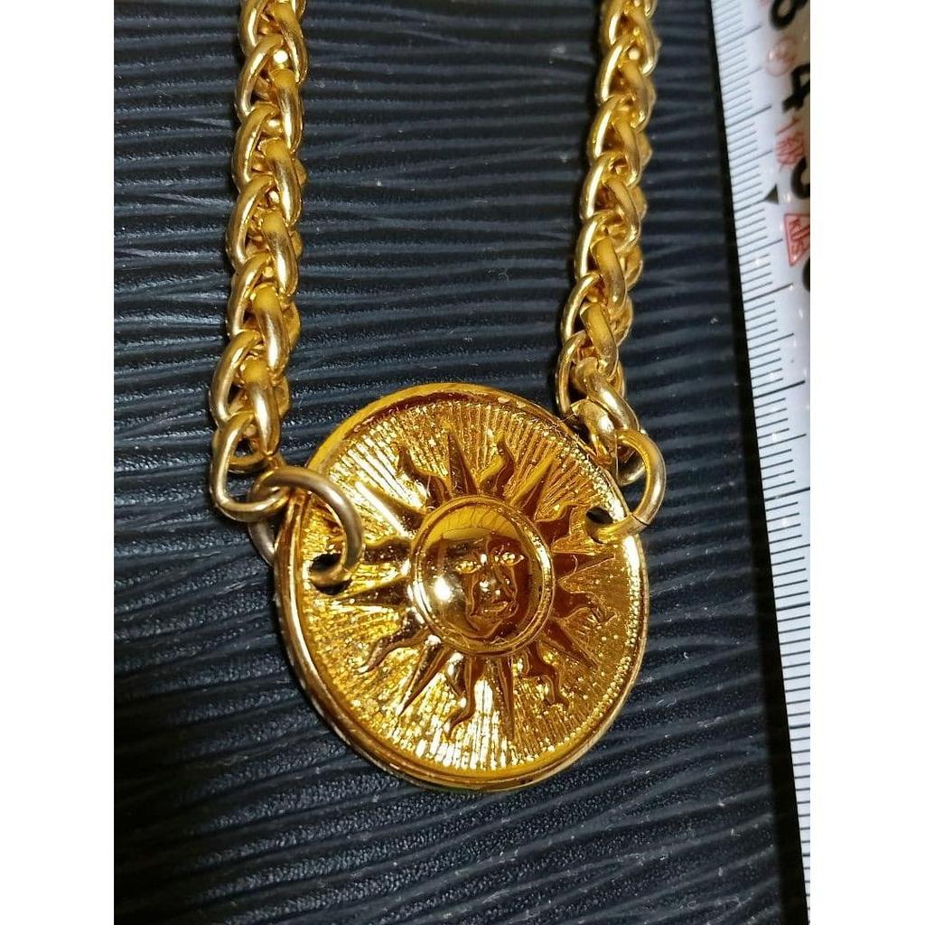 Used Golden Charm with Sun Motif