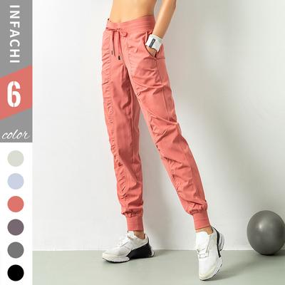 Schnelltrocknende, sportliche Jogginghose für Damen mit Kordelzug in der Taille und Seitentaschen – schmale Passform, atmungsaktive Polyestermischung zum Laufen und Trainieren