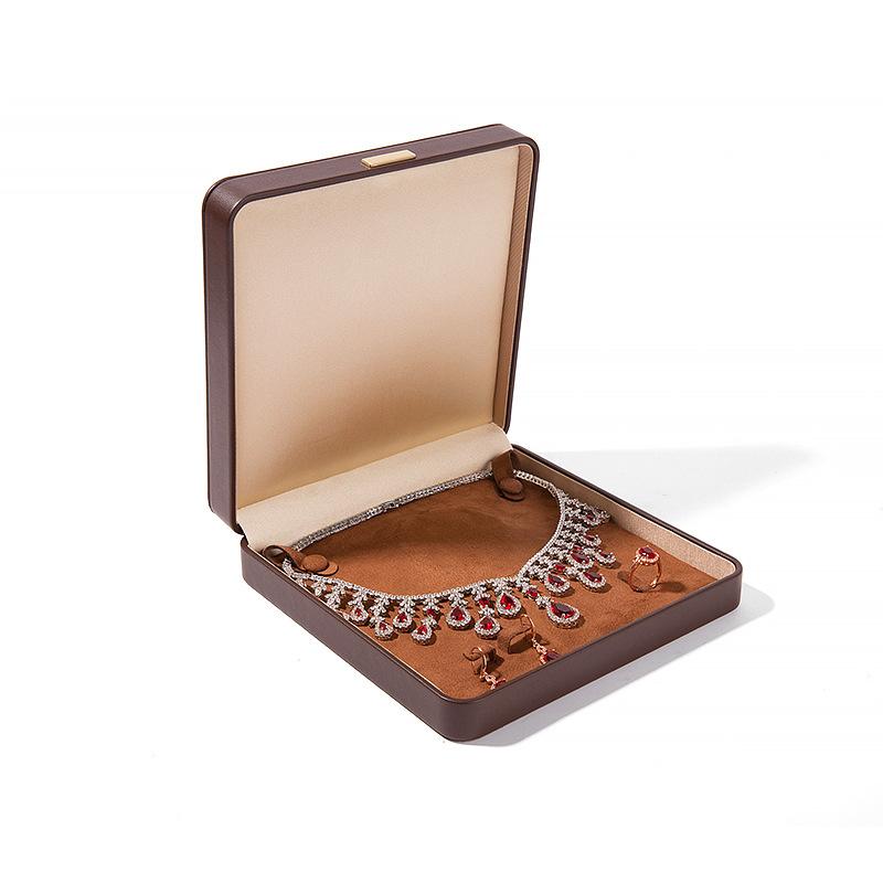 Högkvalitativ PU-läder Rundade Hörn Gyllene Spänne Smyckeskrin Ring Hänge Halsband Armband Förpackning Display Förvaringslåda