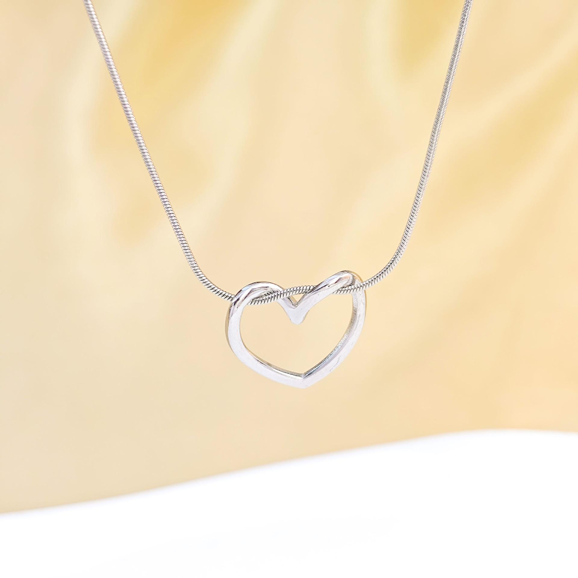 Elegant Hollow Heart Necklace: Real Gold Plated Titanium Steel - Light Luxury for Women