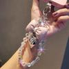 Ins style beaded phone wrist chain, love tie design, universal anti-lost short pendant lanyard for women outdoor shopping travel.