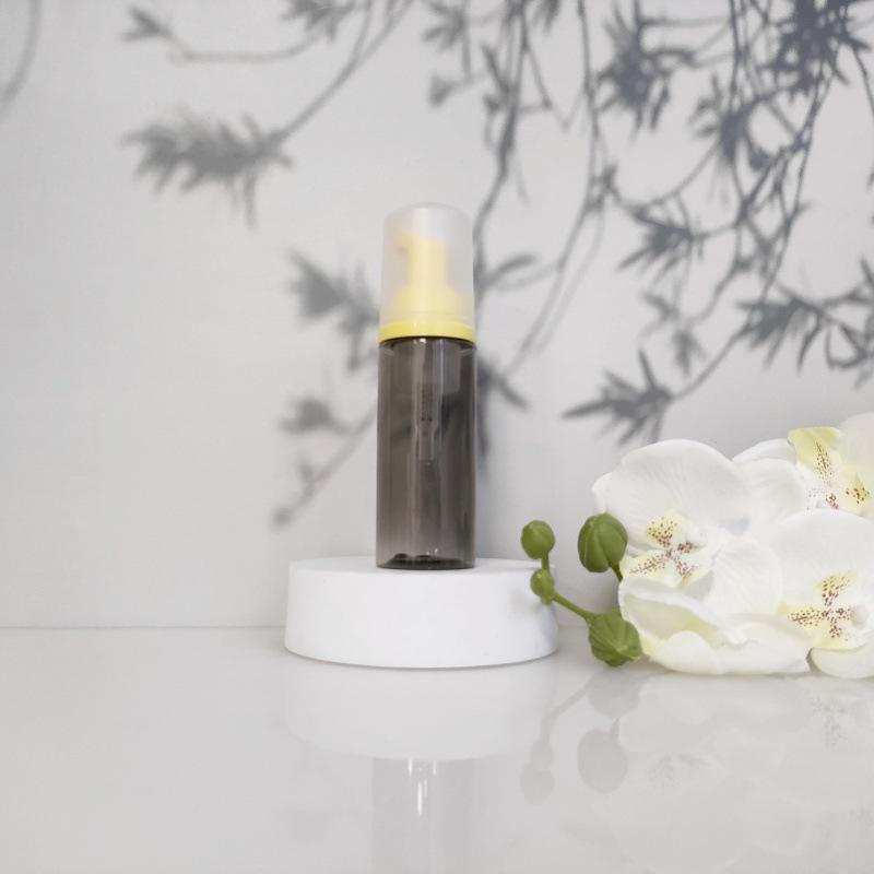 Available 60ml Transparent Black Foam Mousse Bottle for Face Wash and Travel-friendly Cosmetic Packaging.
