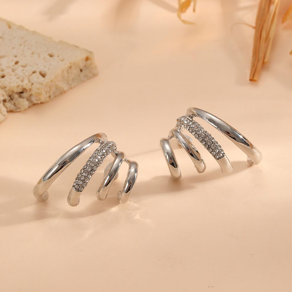 Exaggerated high-end multi-layer claw inlaid antique style earrings with niche design for women's fashionable earrings